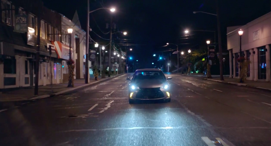 car with headlights on at night