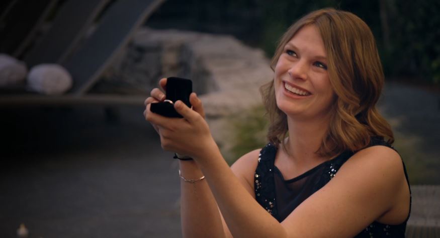 young woman proposing with ring