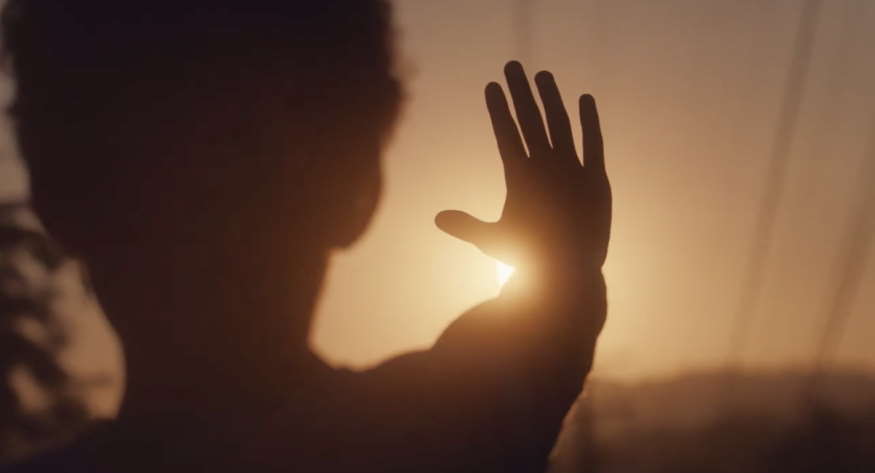 boy looking at the sunset